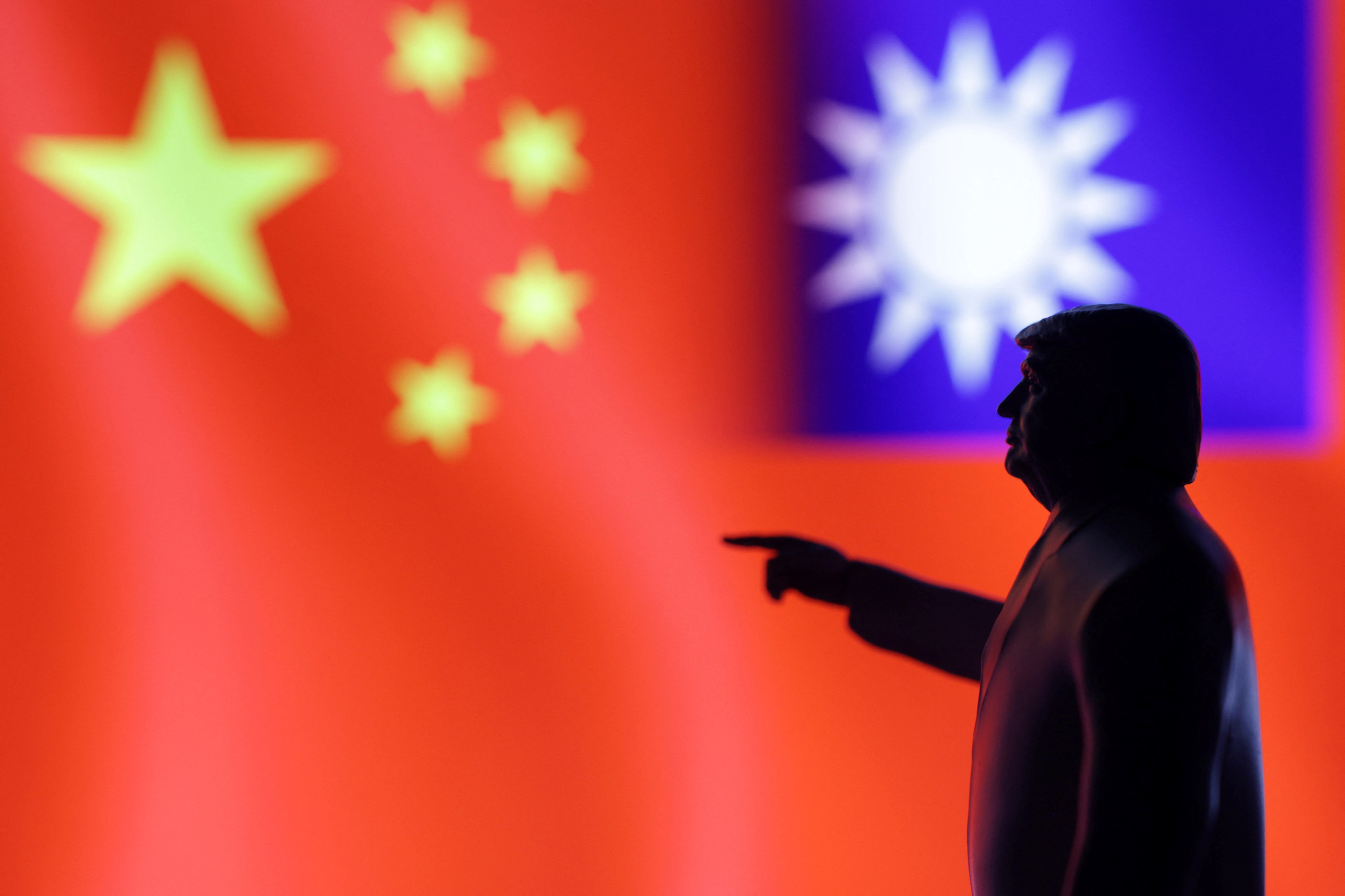 Illustration shows 3D-printed miniature model depicting U.S. President Donald Trum, Chinese flag and fragment of Taiwanese flag