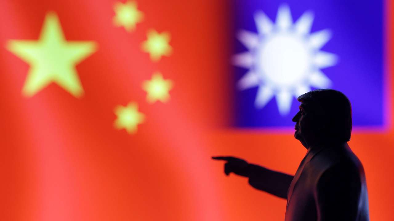 Illustration shows 3D-printed miniature model depicting U.S. President Donald Trum, Chinese flag and fragment of Taiwanese flag