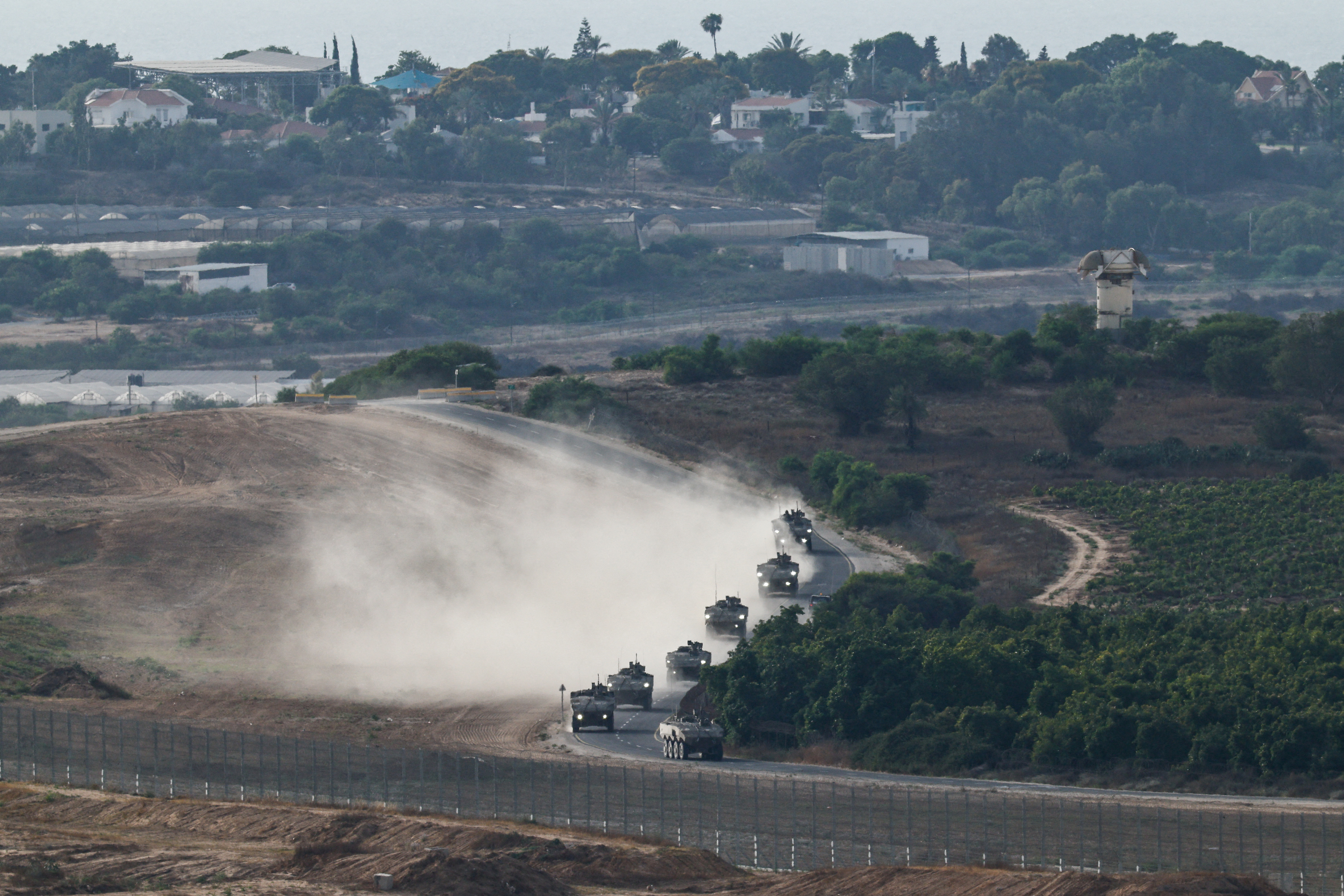 An Israeli military convoy manoeuvres near the Israel-Gaza border