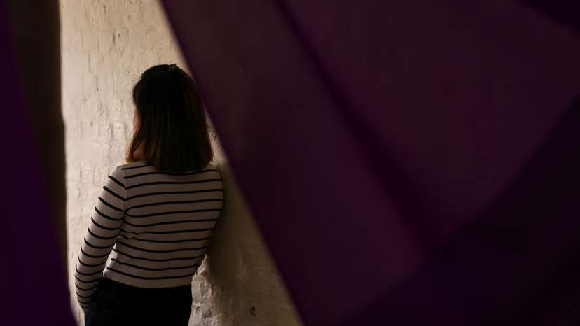 A suspected victim of modern slavery poses for portraits following an interview with Reuters in London