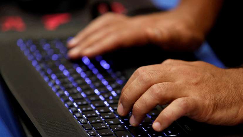 FILE PHOTO: FILE PHOTO: A man types into a keyboard during the Def Con hacker convention in Las Vegas