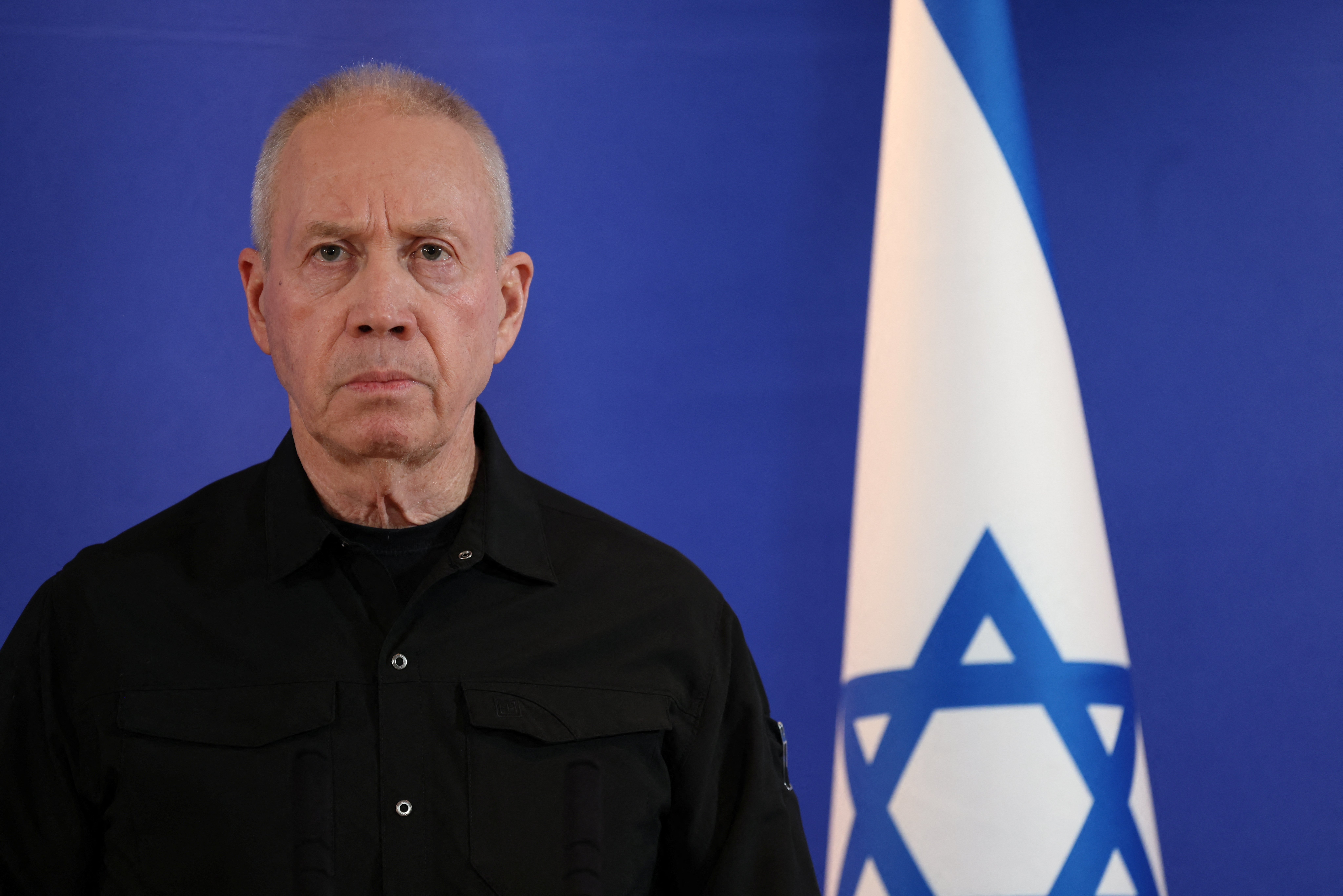Former Israeli Defense Minister Yoav Gallant speaks to members of the press, in Tel Aviv
