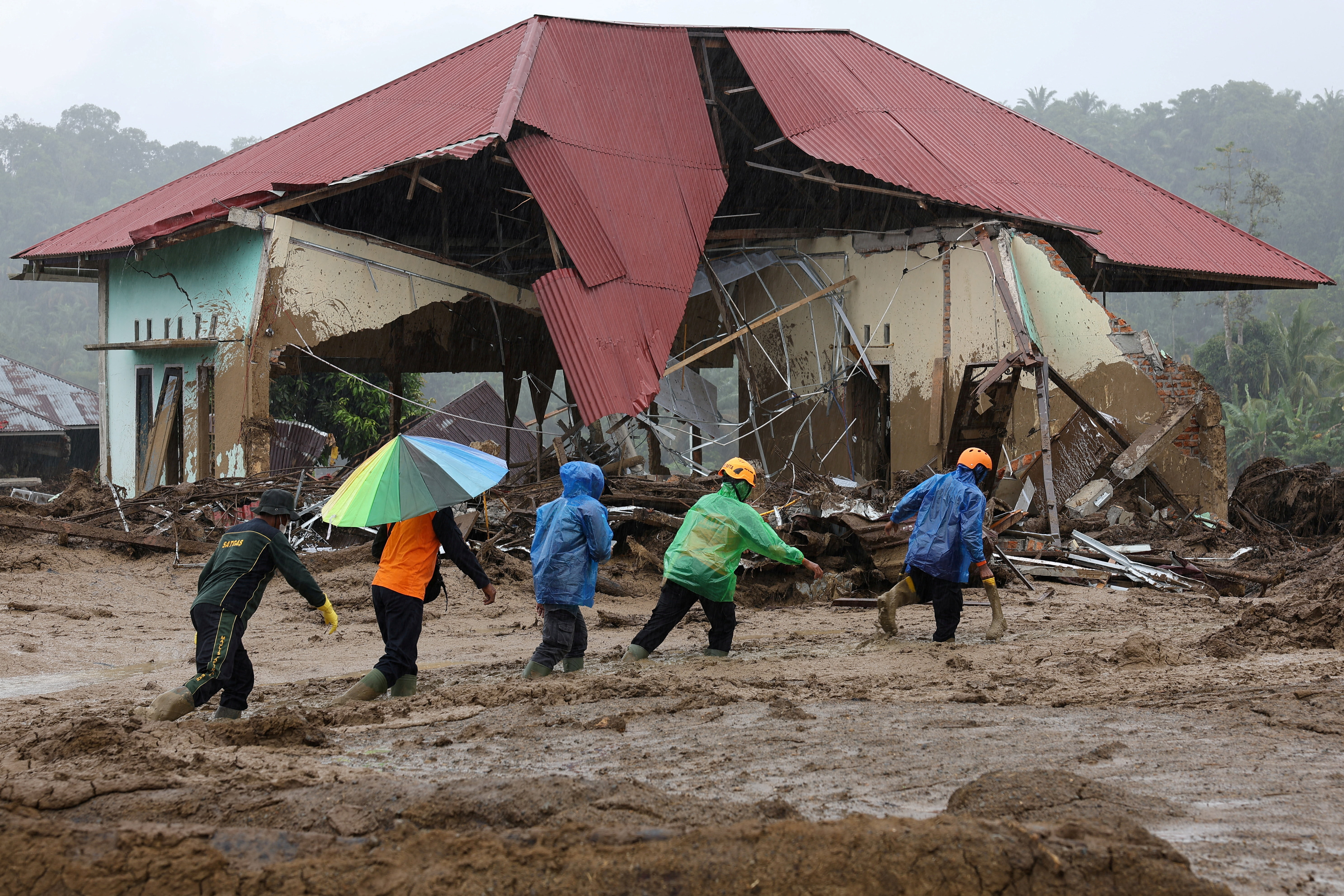 Rescue operations continue at an area hit by flash floods in Palembayan, Agam, West Sumatra