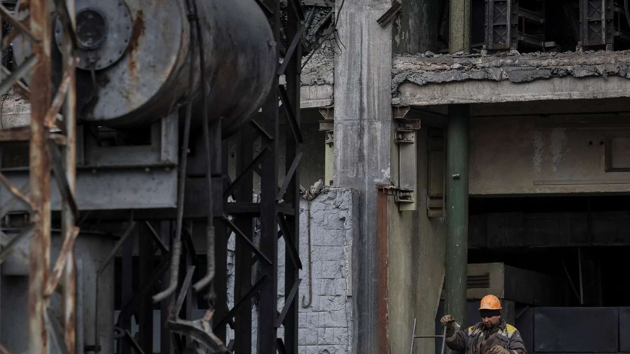 Employees work at a thermal power plant damaged by recent Russian missile strike