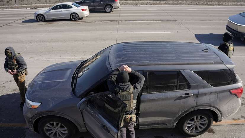 Federal immigration agents conduct immigration enforcement tasks in Minneapolis