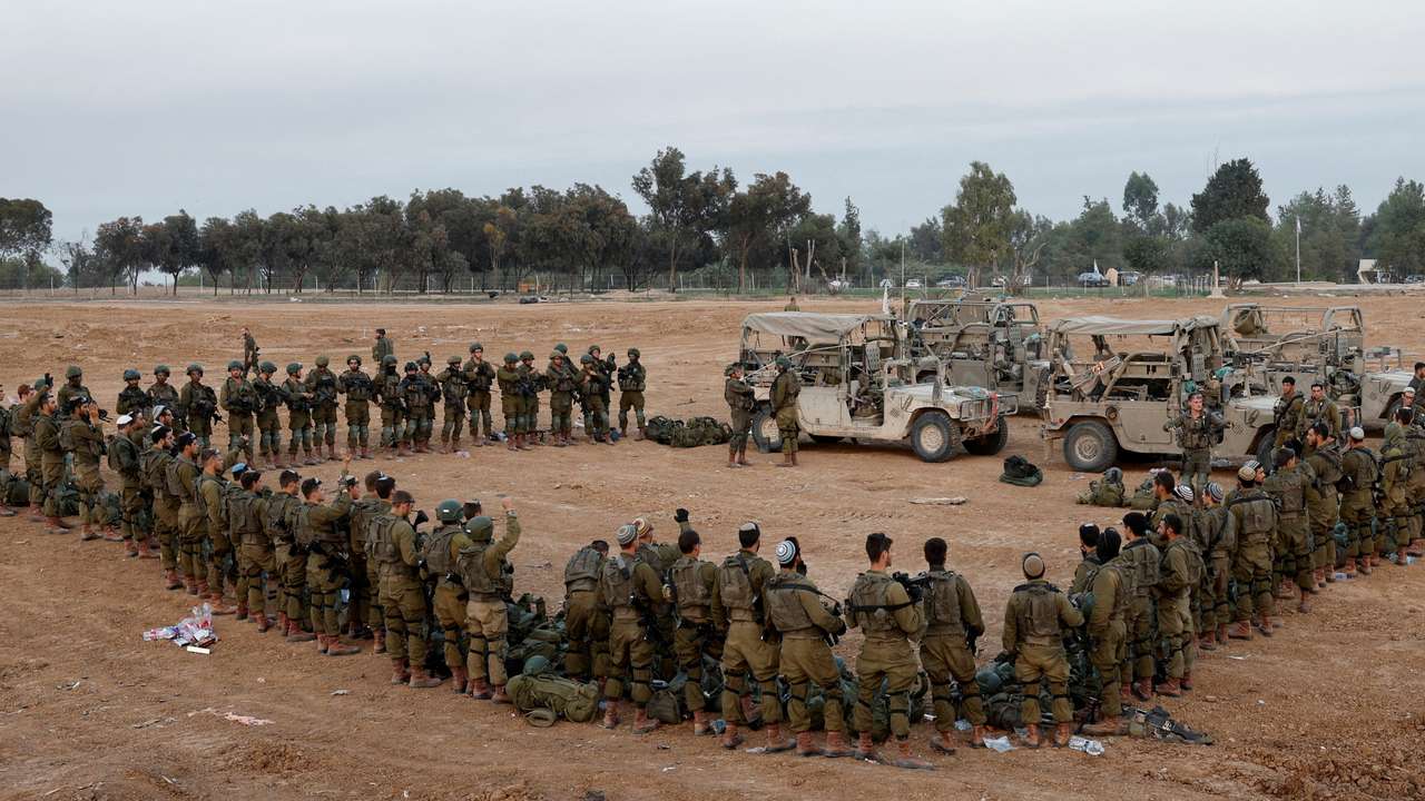 FILE PHOTO: Israeli soldiers stand in order, amid the ongoing conflict between Israel and the Palestinian Islamist group Hamas, near Israel's border with Gaza, in southern Israel