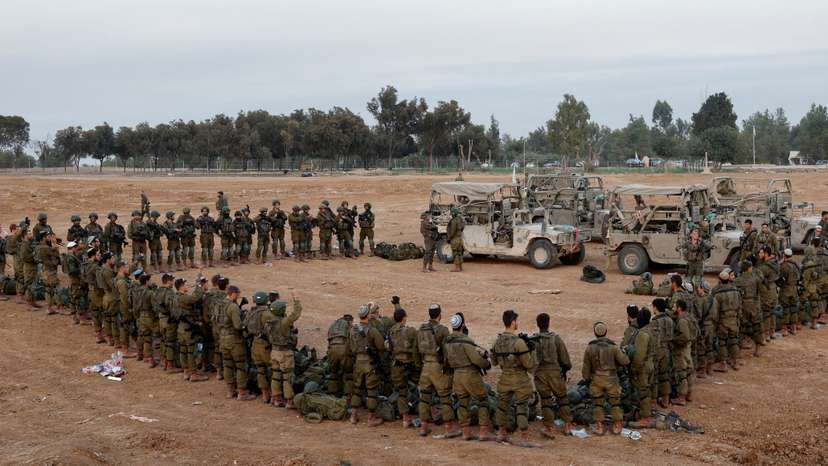 FILE PHOTO: Israeli soldiers stand in order, amid the ongoing conflict between Israel and the Palestinian Islamist group Hamas, near Israel's border with Gaza, in southern Israel