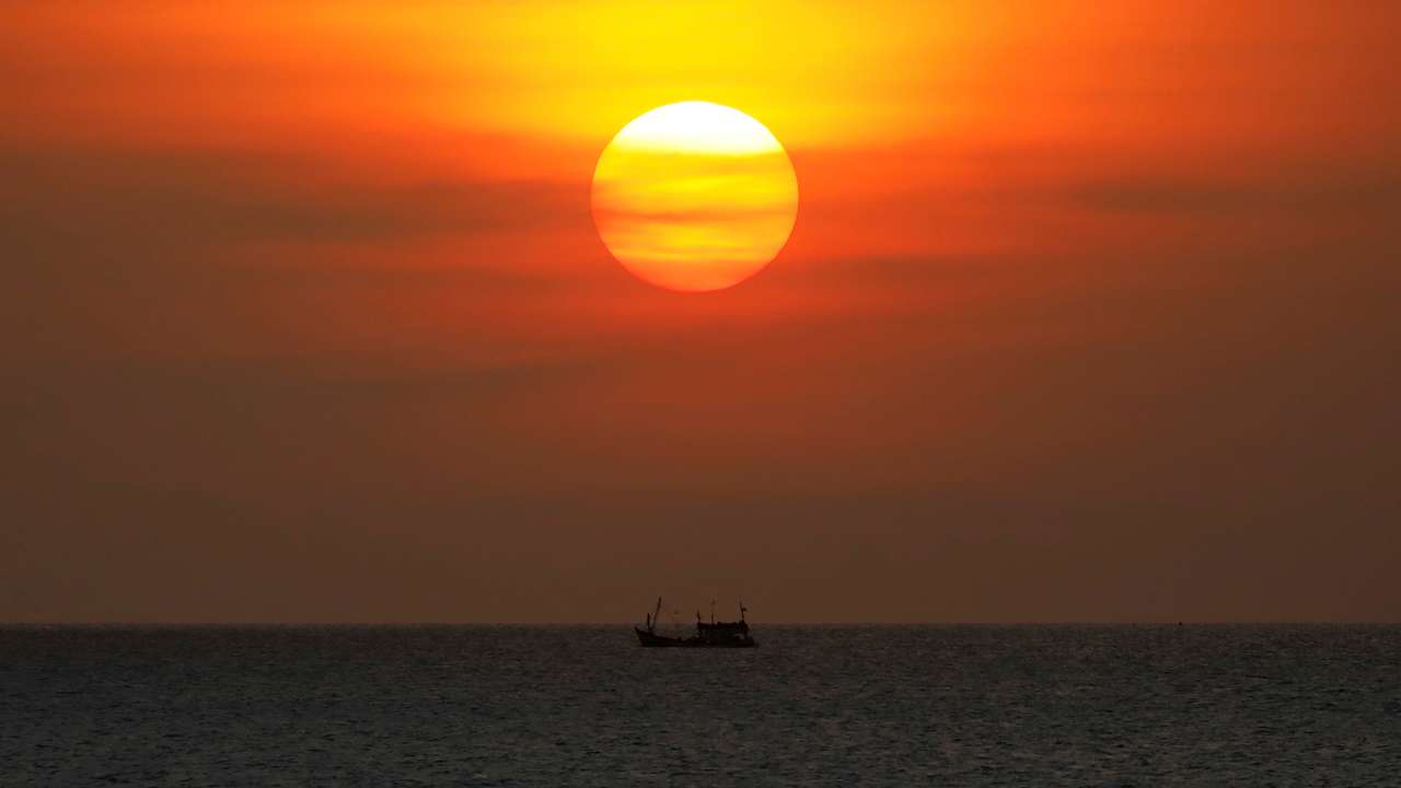 FILE PHOTO: A boat sails on the Gulf Of Thailand during the sunset at Ko Samui in Thailand