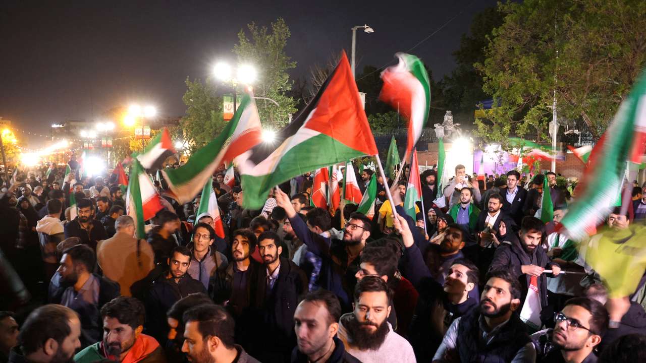 FILE PHOTO: Iranians react after the IRGC attack on Israel, in Tehran, Iran