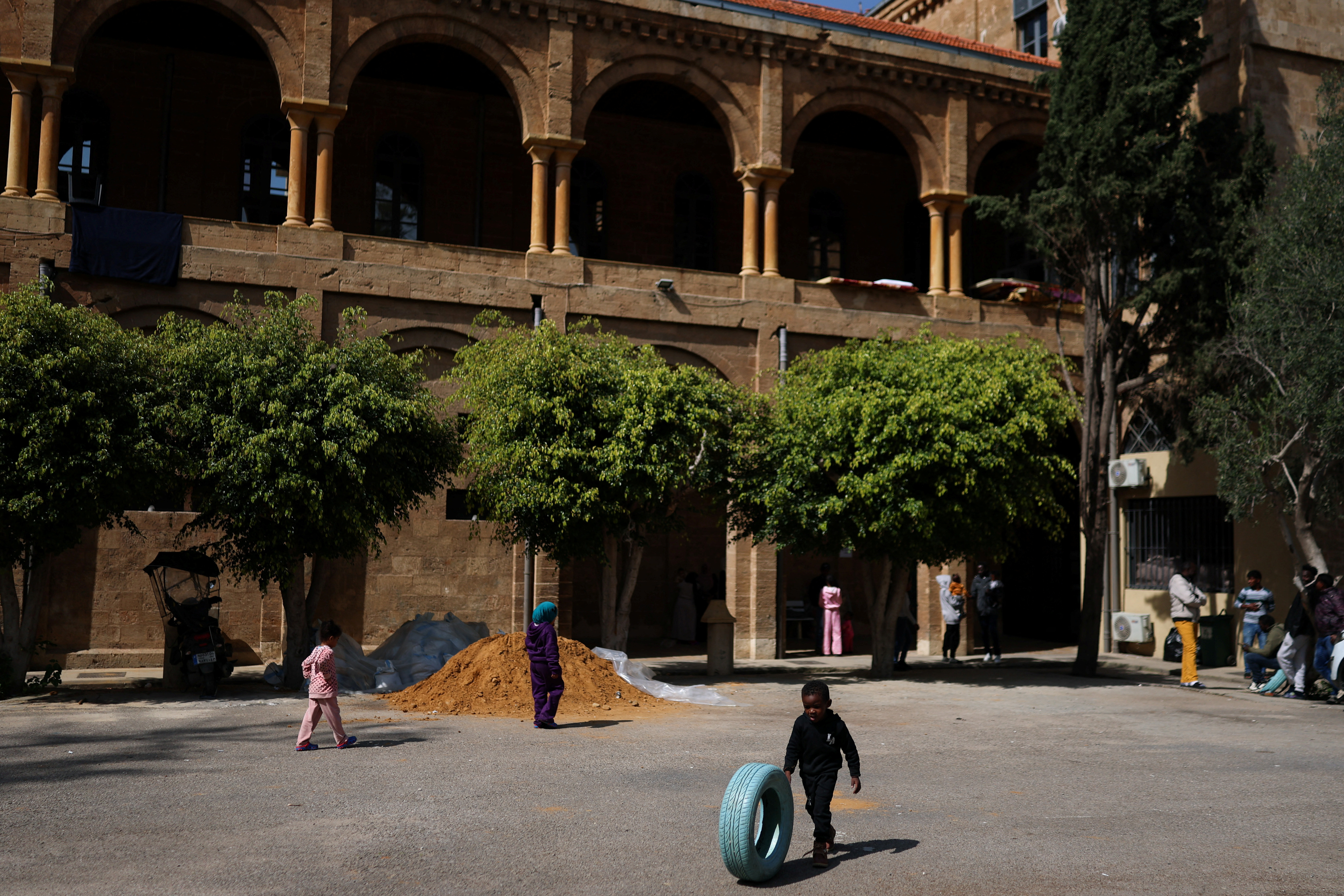 Refugees and displaced migrant workers shelter in St. Joseph Church, following an escalation between Hezbollah and Israel amid the U.S.-Israeli conflict with Iran, in Beirut