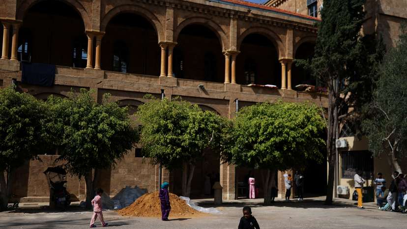 Refugees and displaced migrant workers shelter in St. Joseph Church, following an escalation between Hezbollah and Israel amid the U.S.-Israeli conflict with Iran, in Beirut