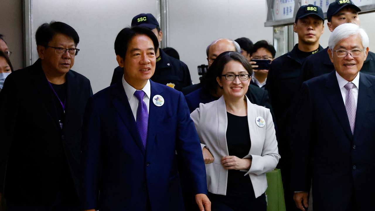 Taiwan's Vice President Lai Ching-te and his running mate Hsiao Bi-Khim arrive to register for the upcoming presidential election, in Taipei