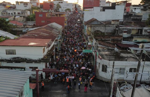 Migrants walk in a caravan in an attempt to reach the U.S. border, in Tapachula