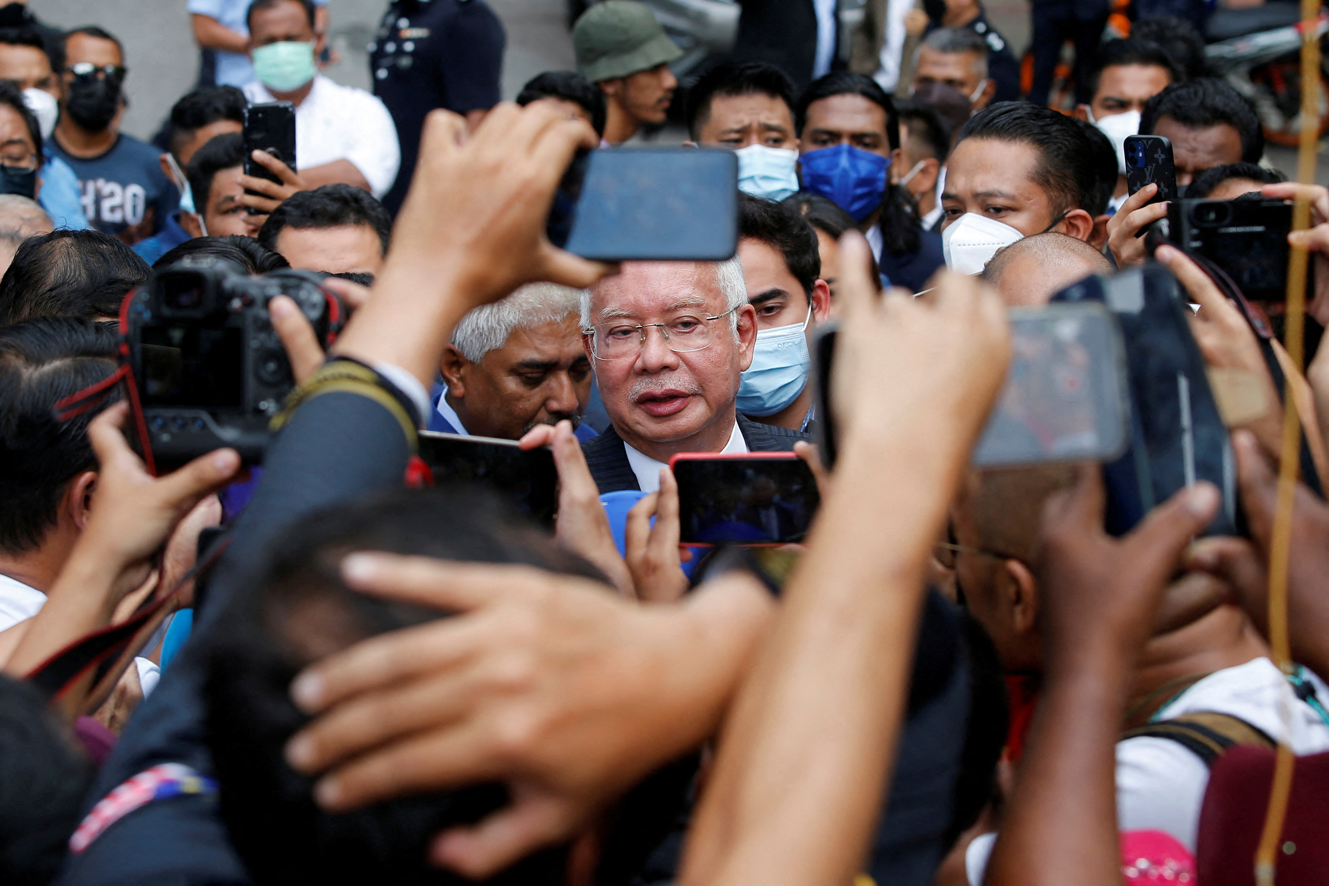 FILE PHOTO: Former Malaysian Prime Minister Najib Razak speaks to journalists outside the Federal Court during a court break, in Putrajaya