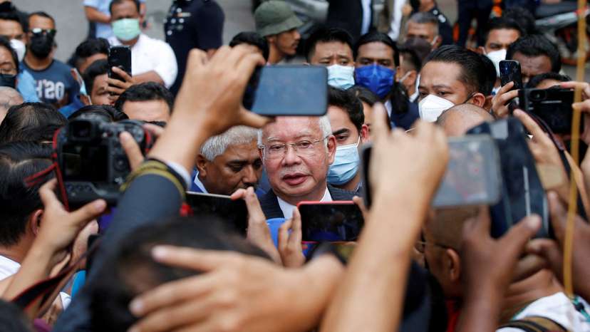 FILE PHOTO: Former Malaysian Prime Minister Najib Razak speaks to journalists outside the Federal Court during a court break, in Putrajaya