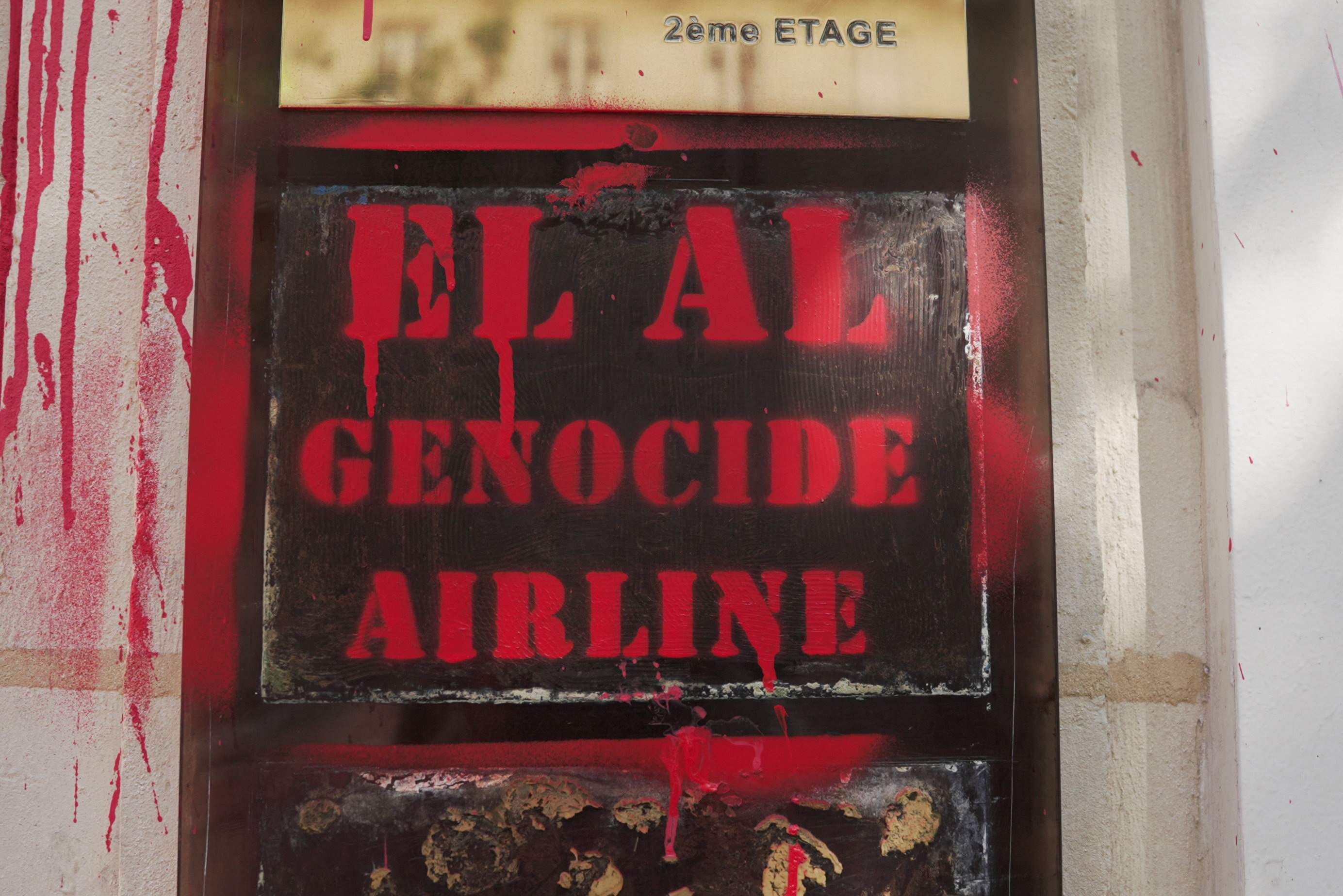 The entrance of the EL AI Israel Airlines offices sprayed with red paint in Paris