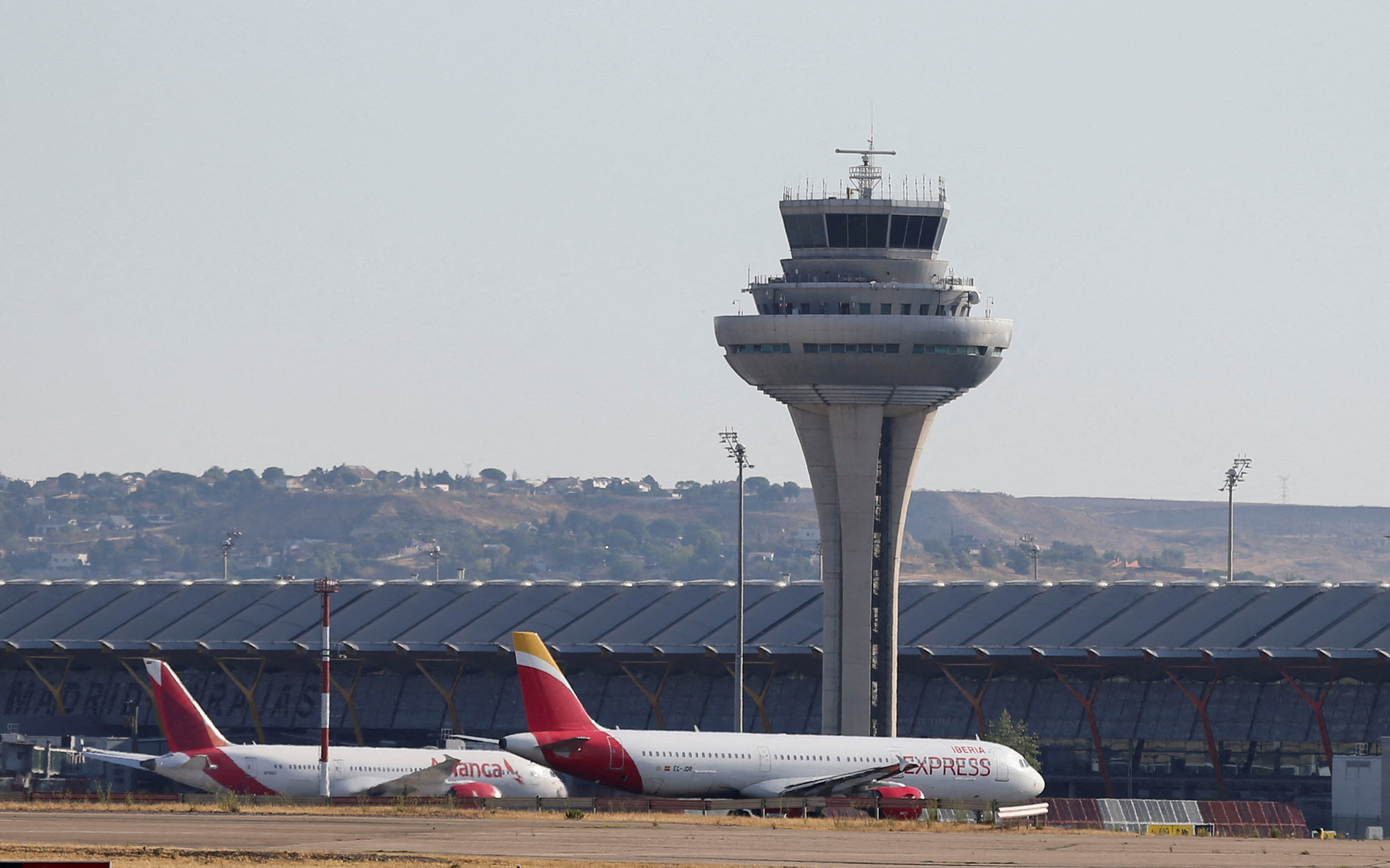 FILE PHOTO: Aircraft are seen on the tarmac of Adolfo Suarez Madrid-Barajas Airport in Madrid
