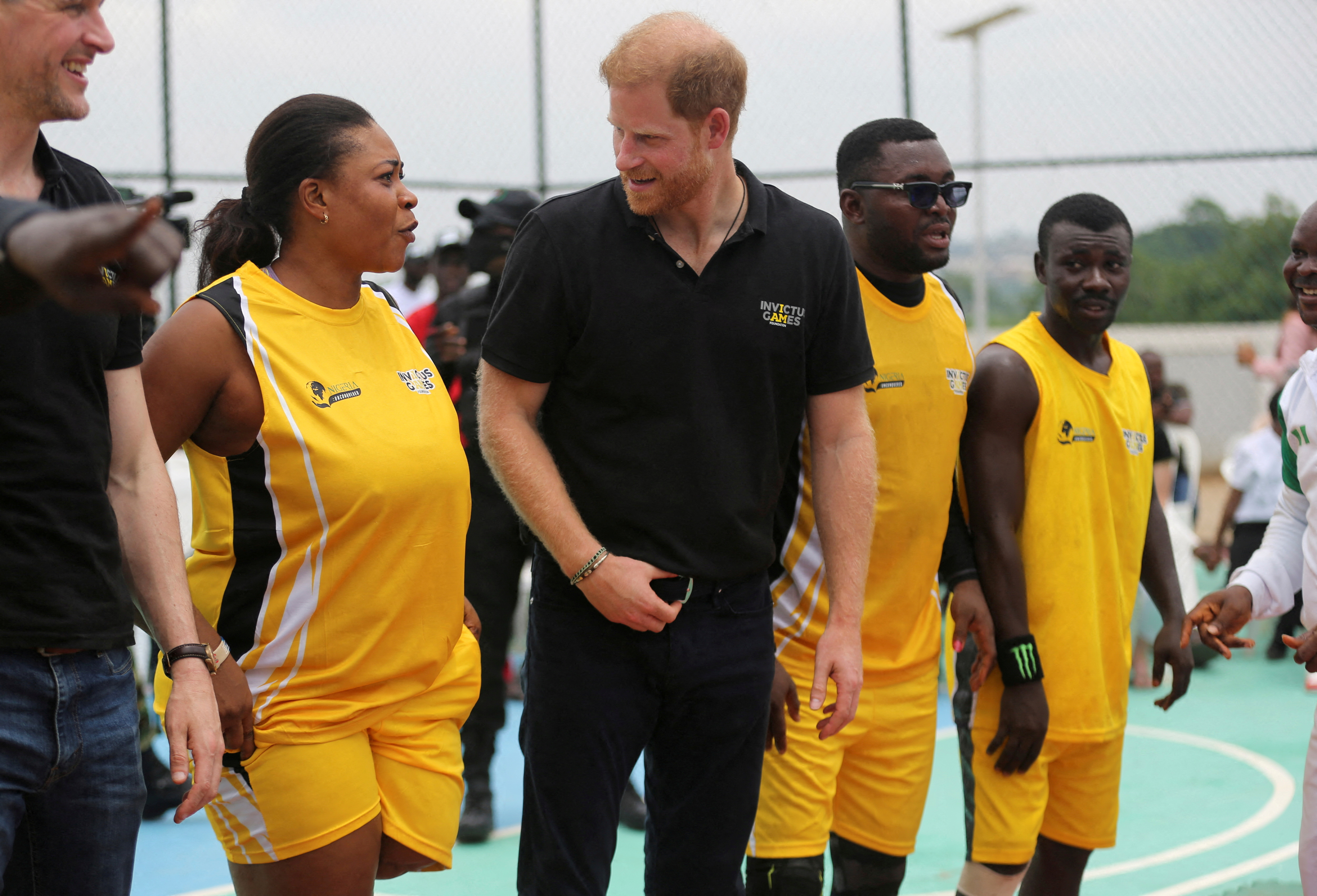 Britain's Prince Harry, Duke of Sussex and his wife Meghan, Duchess of Sussex meet with wounded army veterans in Abuja
