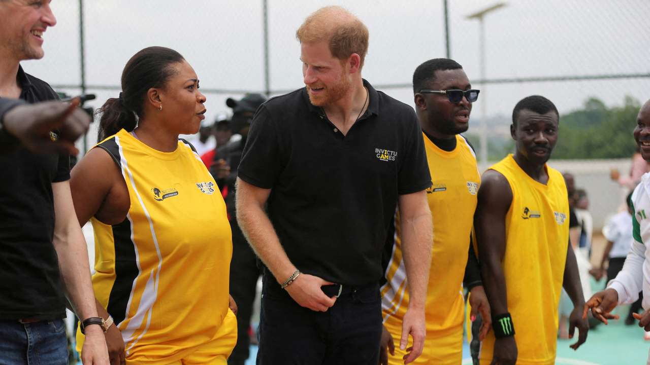 Britain's Prince Harry, Duke of Sussex and his wife Meghan, Duchess of Sussex meet with wounded army veterans in Abuja