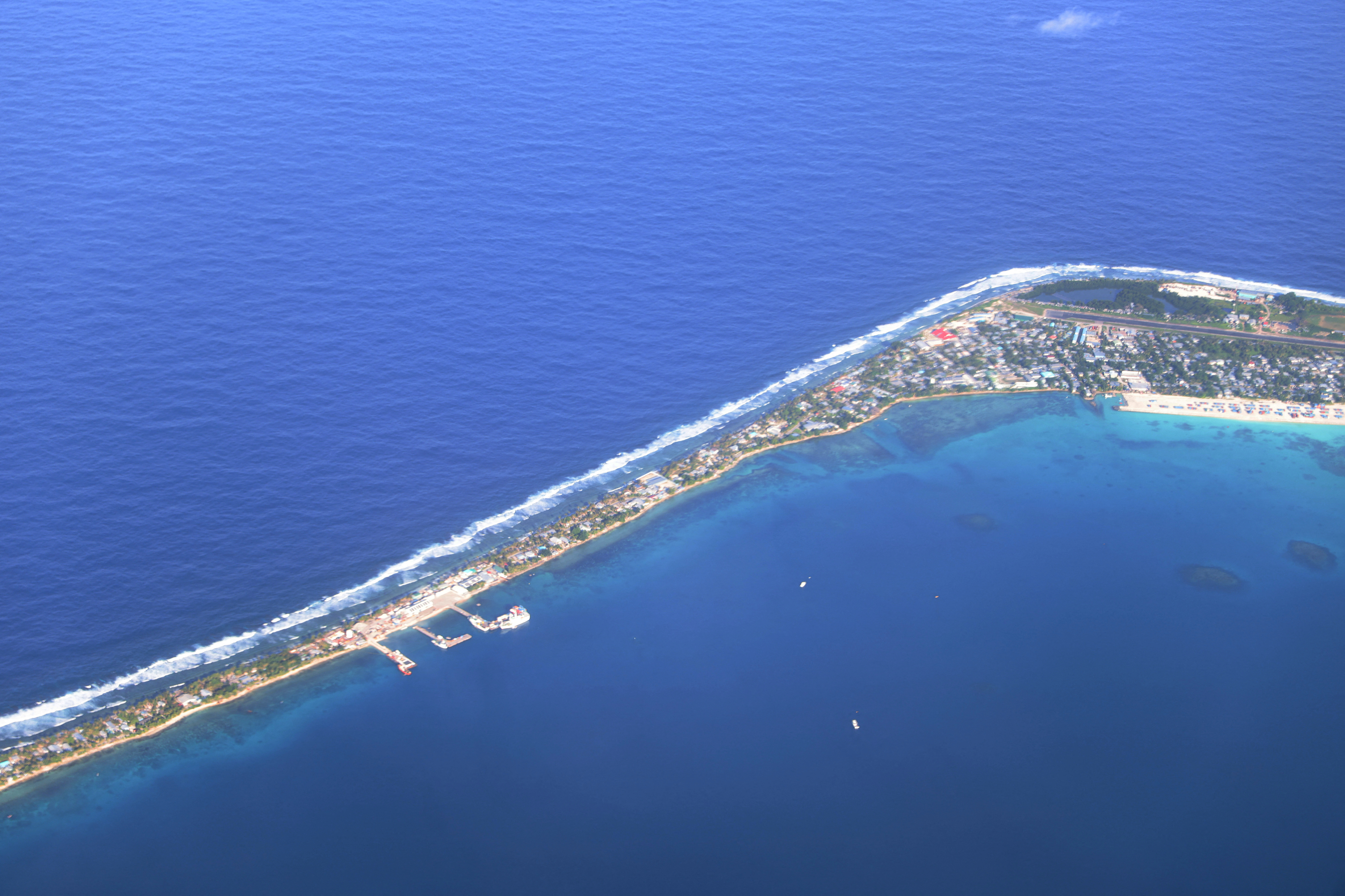 Aerial view of Funafuti, Tuvalu’s most populous island, showing the port and main town of Fongafale