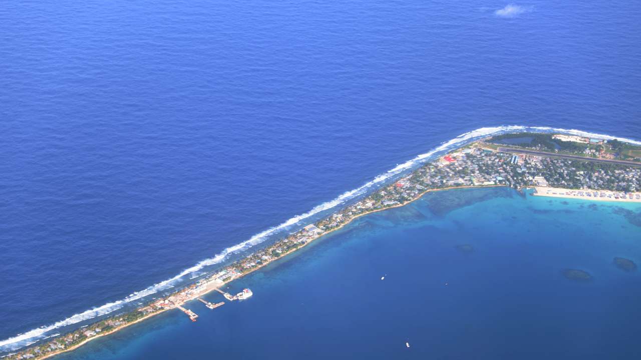 Aerial view of Funafuti, Tuvalu’s most populous island, showing the port and main town of Fongafale