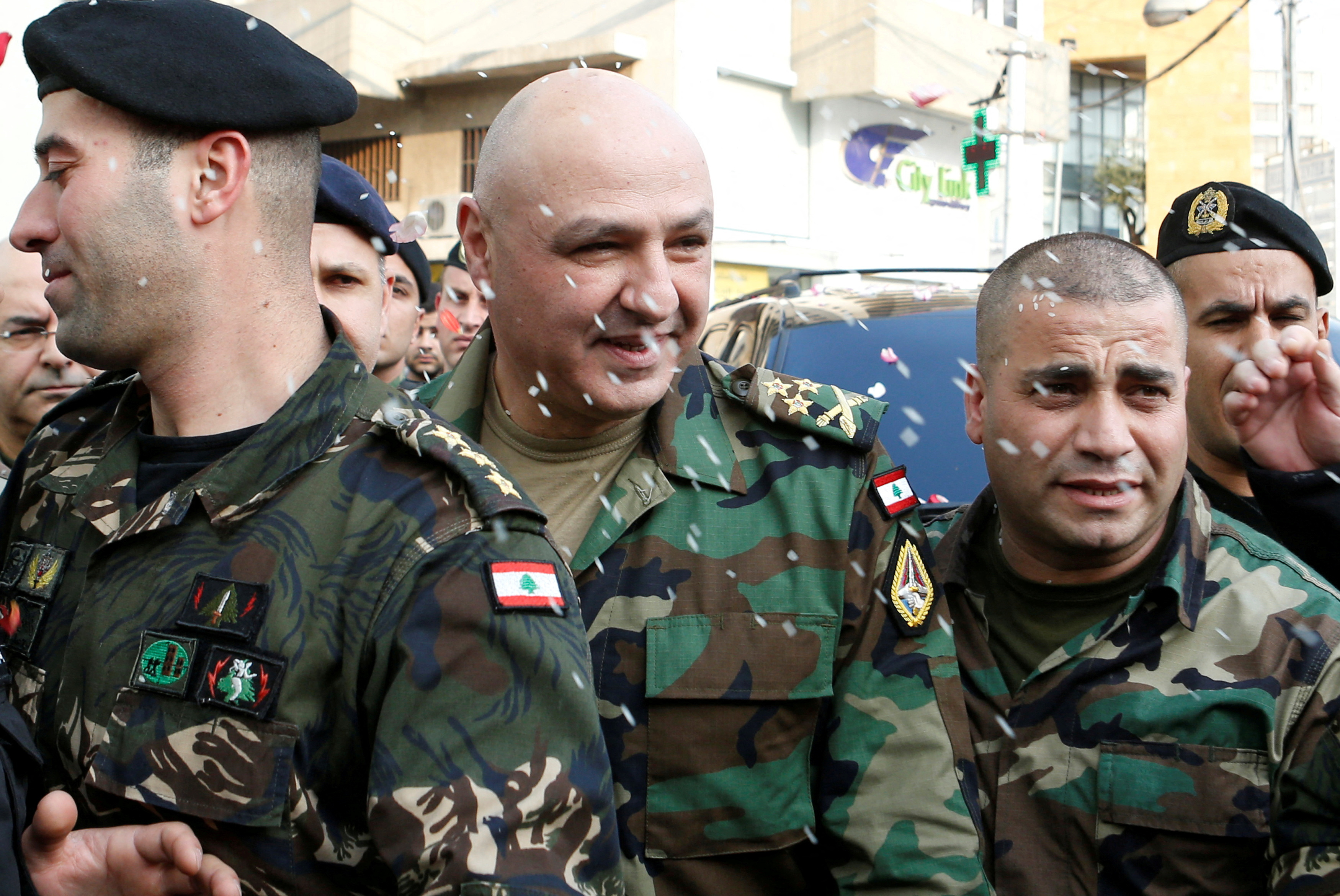 FILE PHOTO: Rice is thrown on Newly-appointed General Joseph Aoun as army commander, upon his arrival at his family's house in Sin El Fil