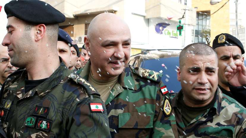 FILE PHOTO: Rice is thrown on Newly-appointed General Joseph Aoun as army commander, upon his arrival at his family's house in Sin El Fil