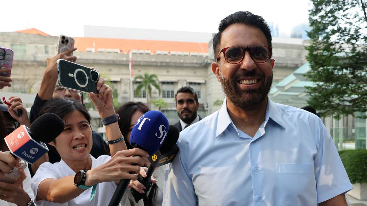 Singapore's Workers' Party Chief Pritam Singh walks outside the State Courts in Singapore