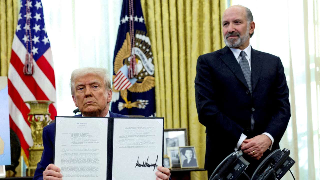 FILE PHOTO: U.S. President Donald Trump signs executive orders for reciprocal tariffs in Washington