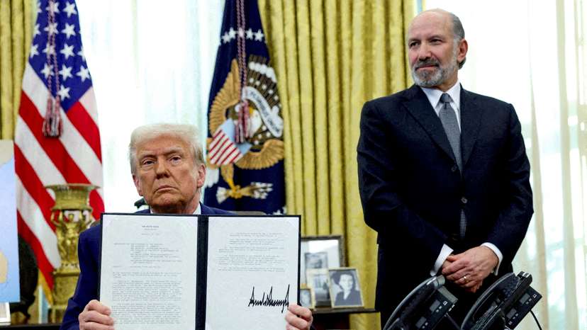 FILE PHOTO: U.S. President Donald Trump signs executive orders for reciprocal tariffs in Washington