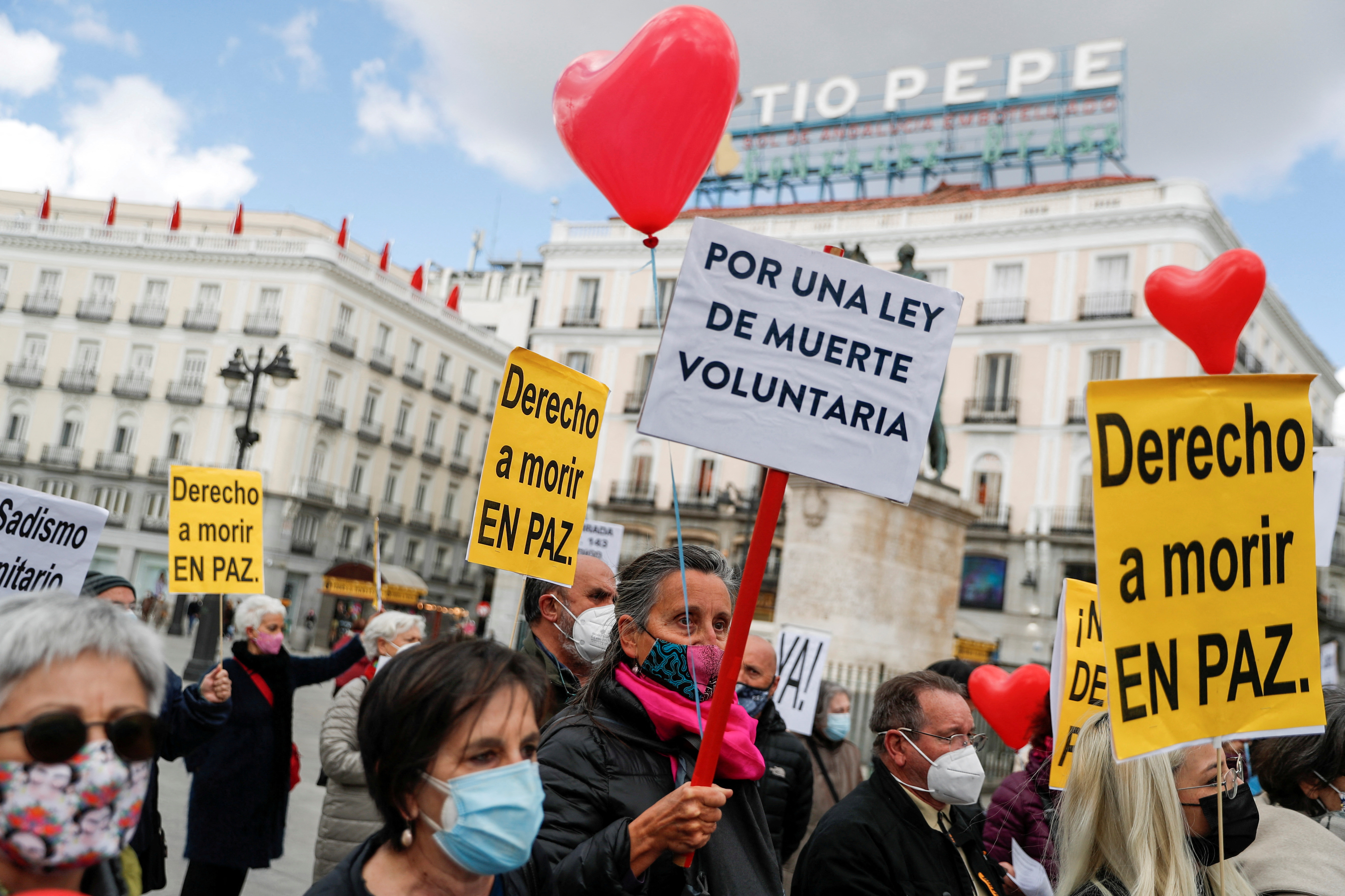 FILE PHOTO: Supporters of a law to legalise euthanasia gather as Spanish Parliament votes to approve it in Madrid