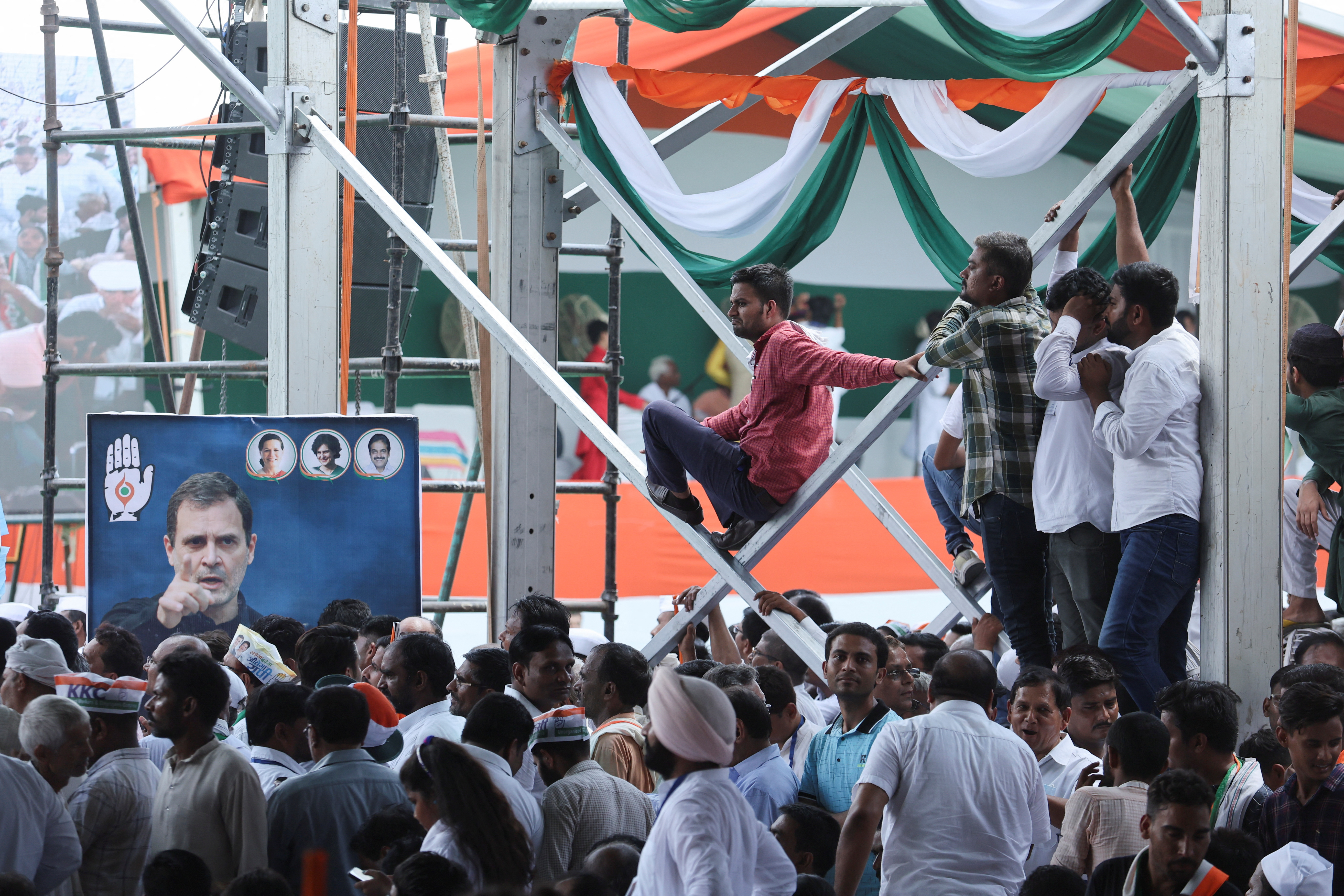 People attend a massive rally organised by India's main opposition Congress party against inflation, at Ramlila Ground