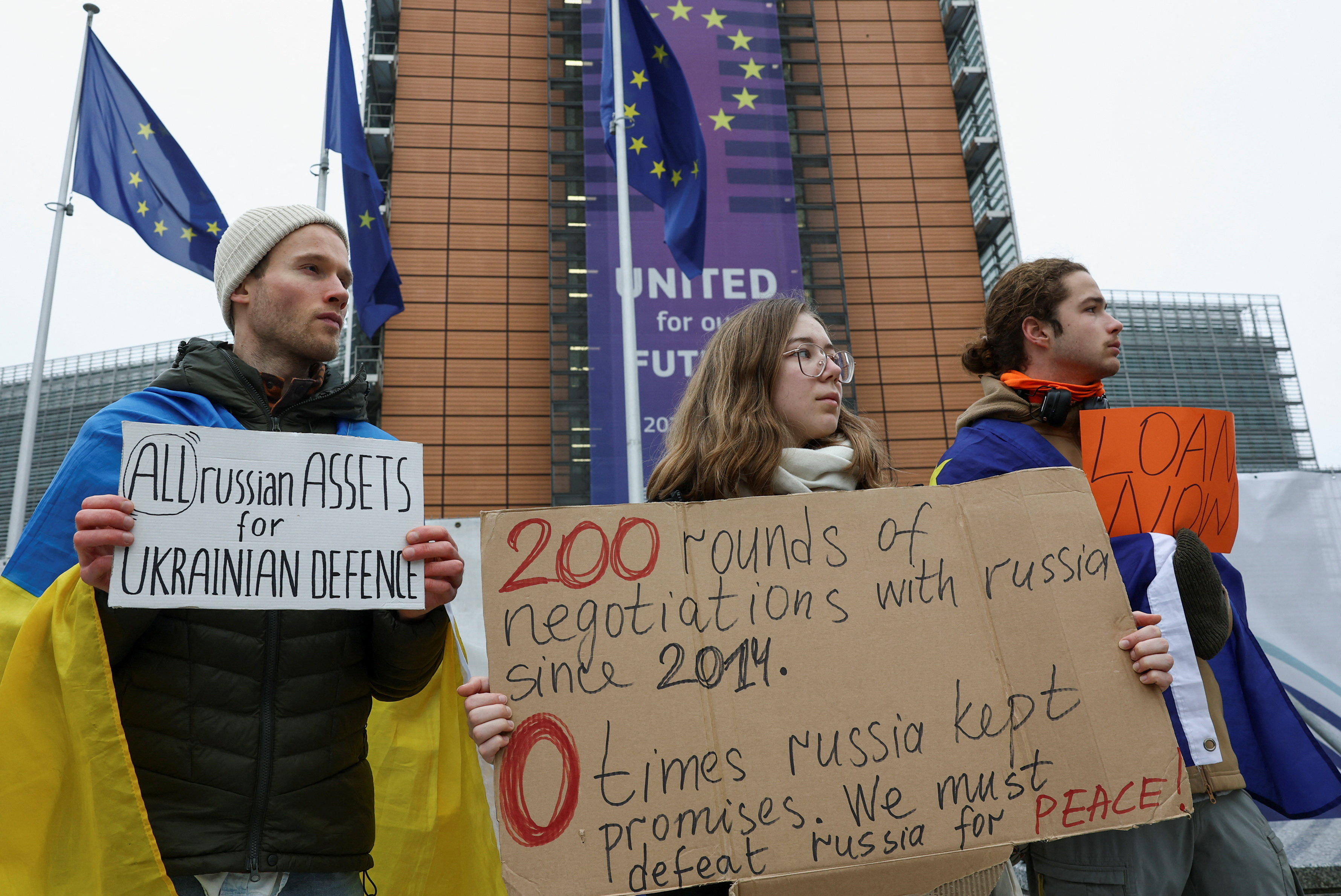 People demonstrate outside the European Commission in Brussel