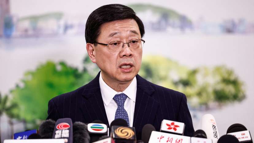 Chief Executive of Hong Kong John Lee speaks during a press conference in Beijing