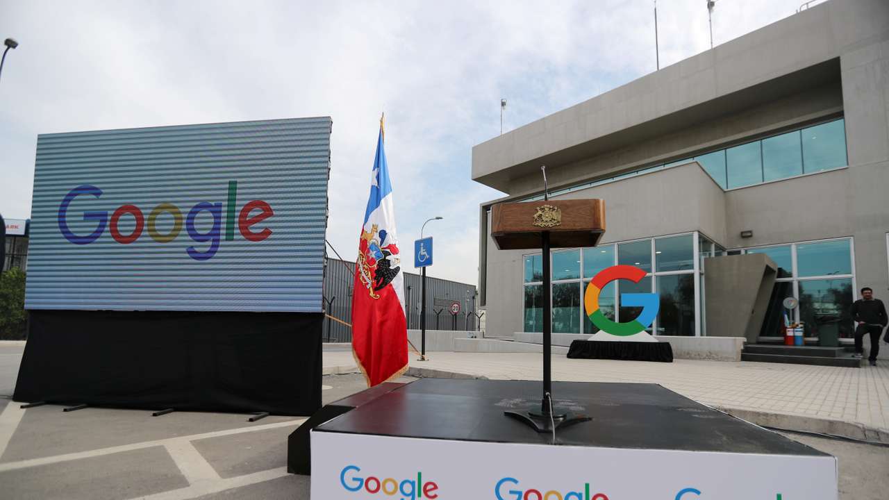 Google logos are seen during the announcement of the plans for their data centre expansion in Santiago