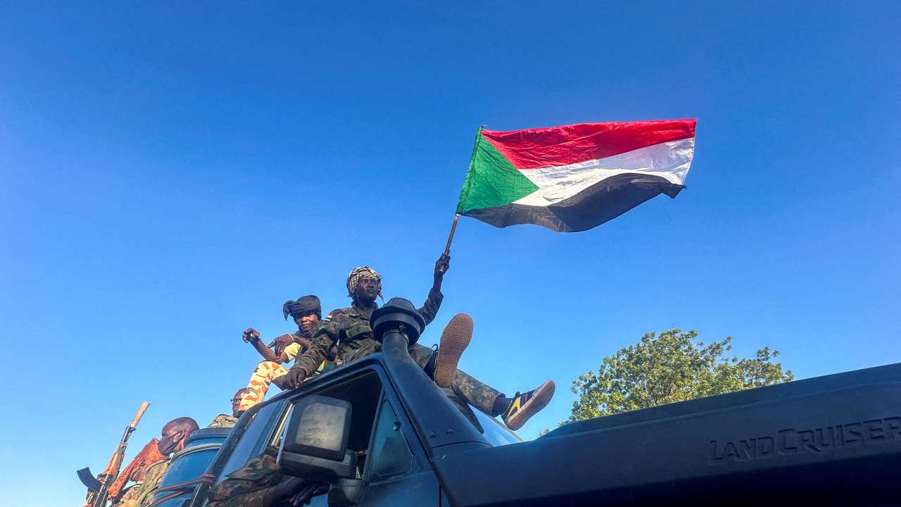 FILE PHOTO: Sudan's army soldiers celebrate after entering Wad Madani