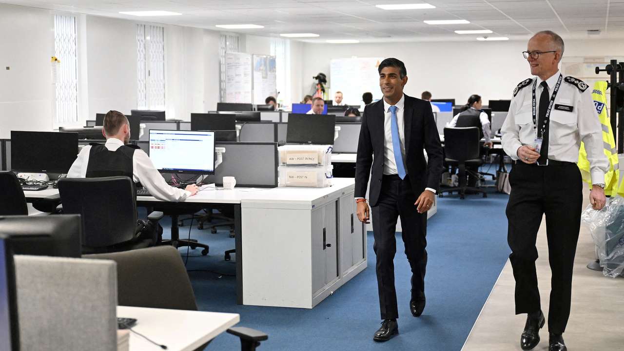 Britain's PM Sunak looks at knives and machetes seized from knife attacks in London