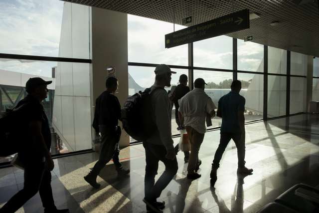 Brazilian migrants deported from the U.S. under President Trump's administration, board a Brazilian Air Force flight, in Manaus