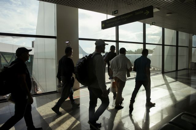 Brazilian migrants deported from the U.S. under President Trump's administration, board a Brazilian Air Force flight, in Manaus