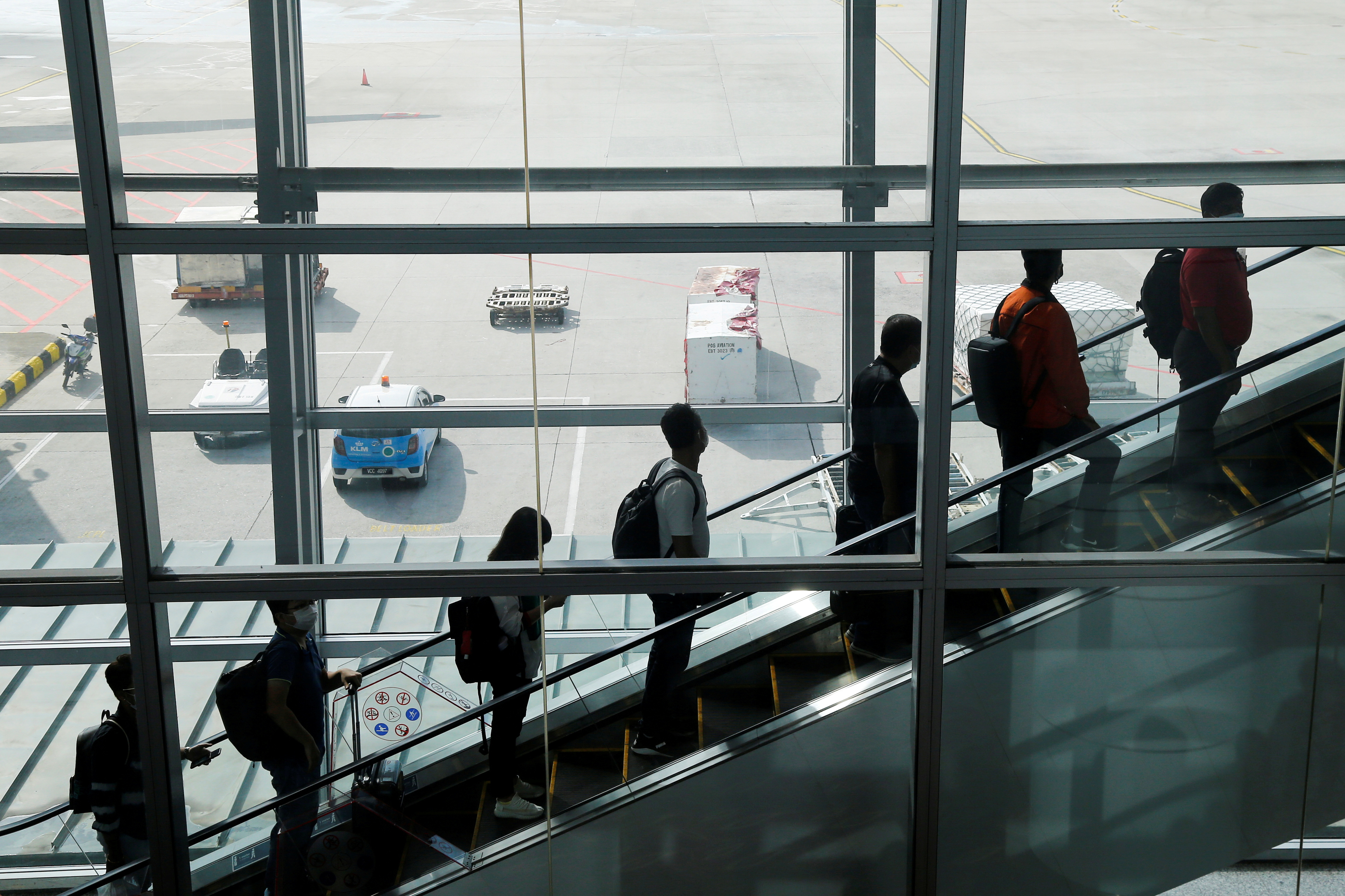 Travellers arrive at Kuala Lumpur International Airport under the Malaysia-Singapore Vaccinated Travel Lane programme, in Sepang