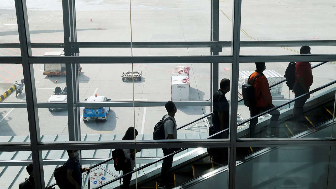 Travellers arrive at Kuala Lumpur International Airport under the Malaysia-Singapore Vaccinated Travel Lane programme, in Sepang