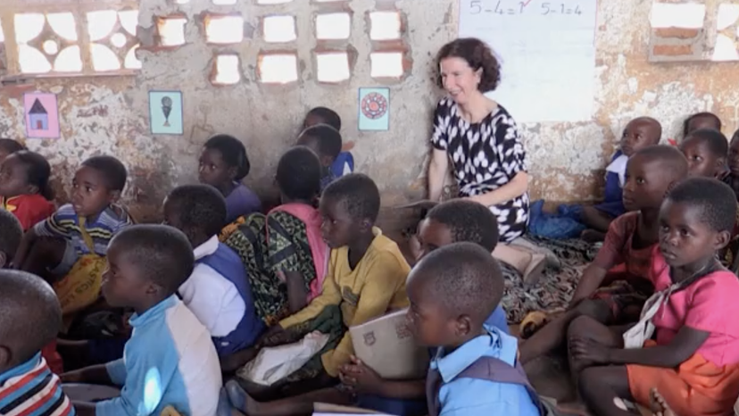 UK's development minister Anneliese Dodds with students at a primary school in Lilongwe, Malawi