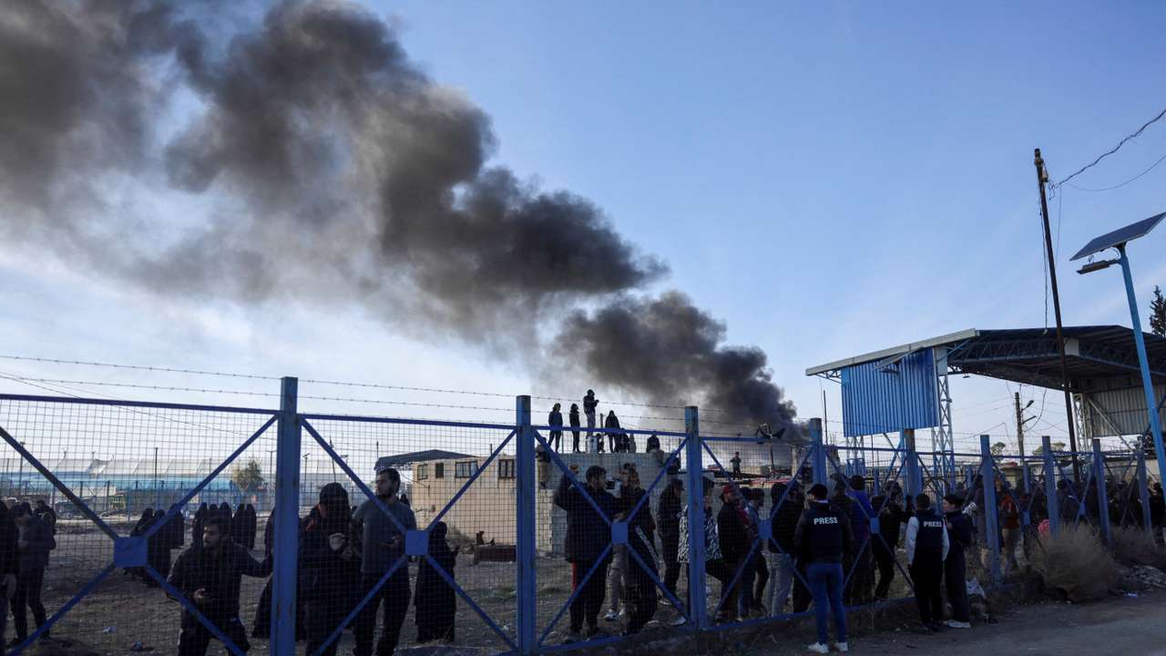FILE PHOTO: Detainees gather at al-Hol camp after the Syrian government took control of it, in Hasaka