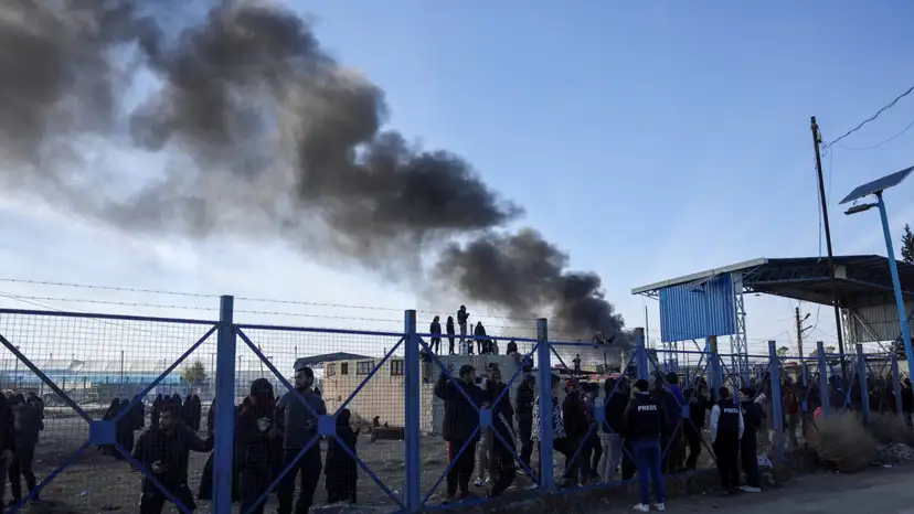 FILE PHOTO: Detainees gather at al-Hol camp after the Syrian government took control of it, in Hasaka
