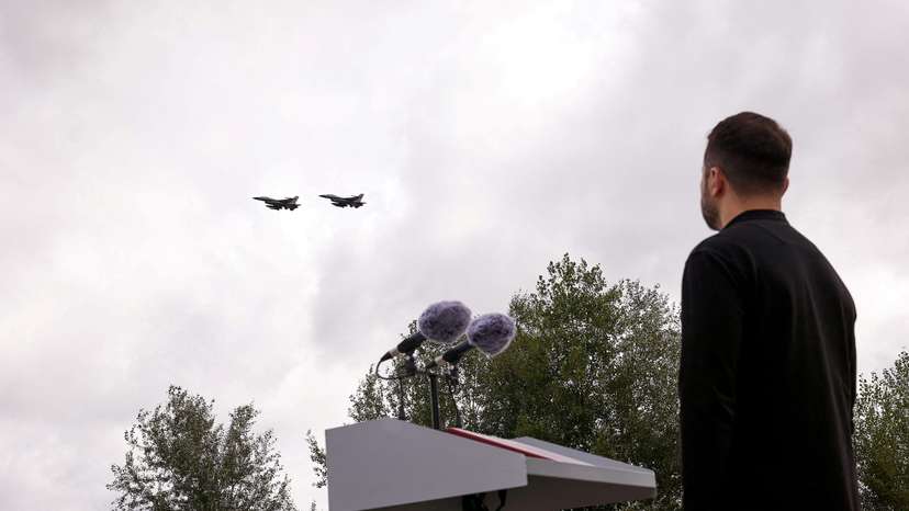 Ukraine's President Zelenskiy looks at F-16 fighter aircraft on the Day of the Ukrainian Air Forces in an undisclosed location in Ukraine