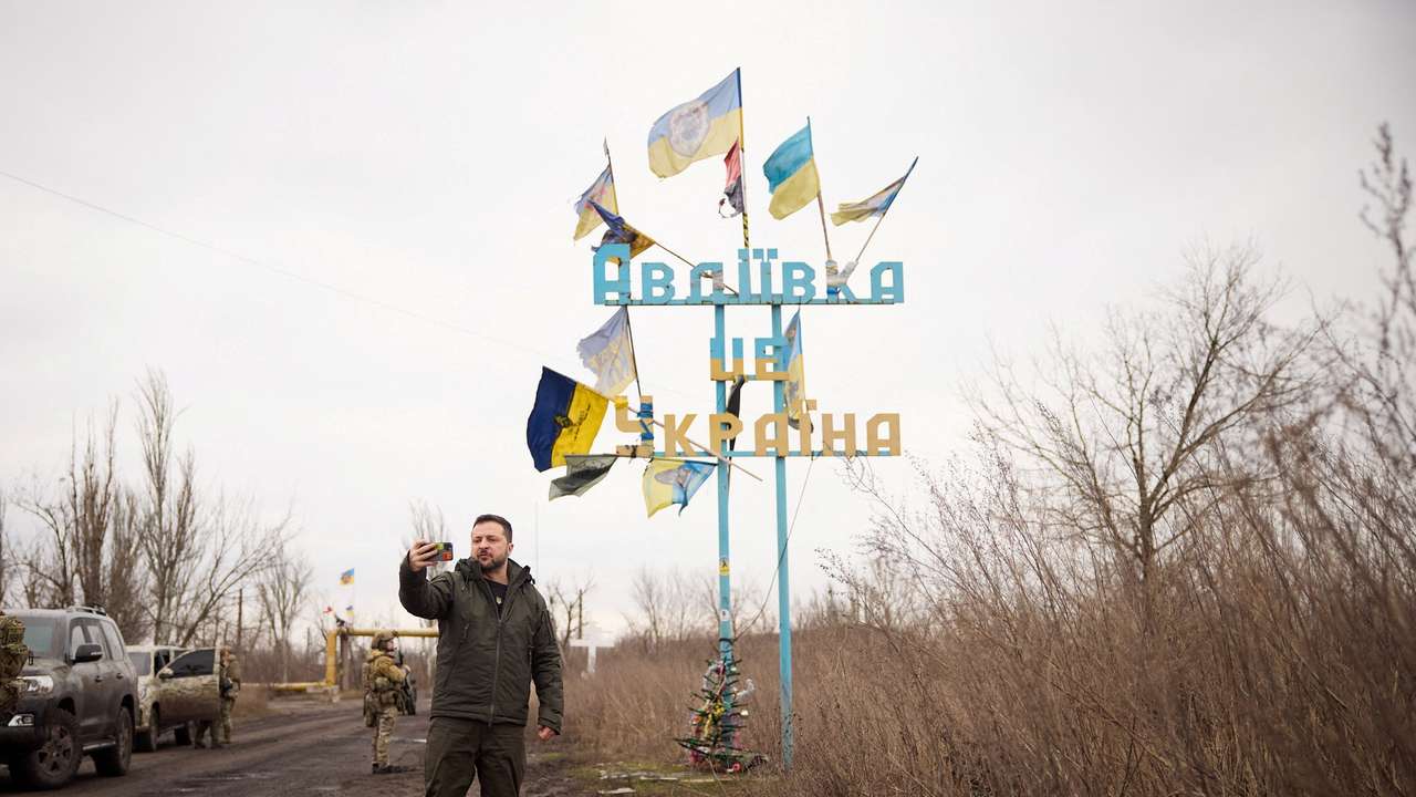 Ukraine's President Zelenskiy takes a video, as he visits in the frontline town of Avdiivka