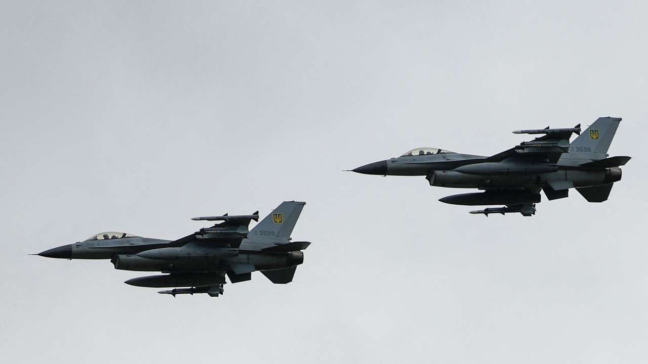 Ukrainian F-16 fighting aircrafts are seen in the air during marking the Day of the Ukrainian Air Forces in an undisclosed location in Ukraine