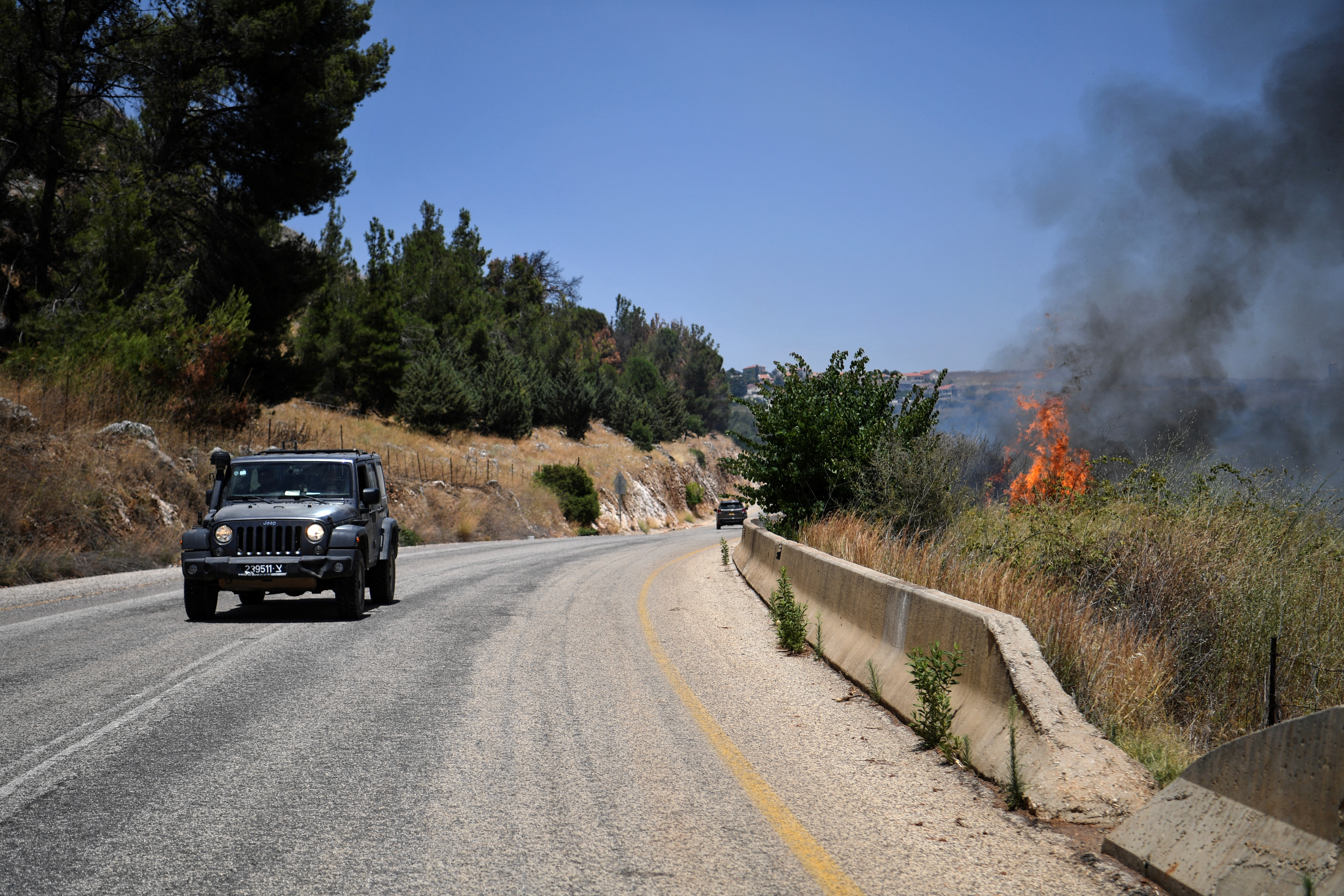 A fire blazes on the Israeli side of the Israel-Lebanon border following attacks from Lebanon, amid cross-border hostilities between Hezbollah and Israeli forces