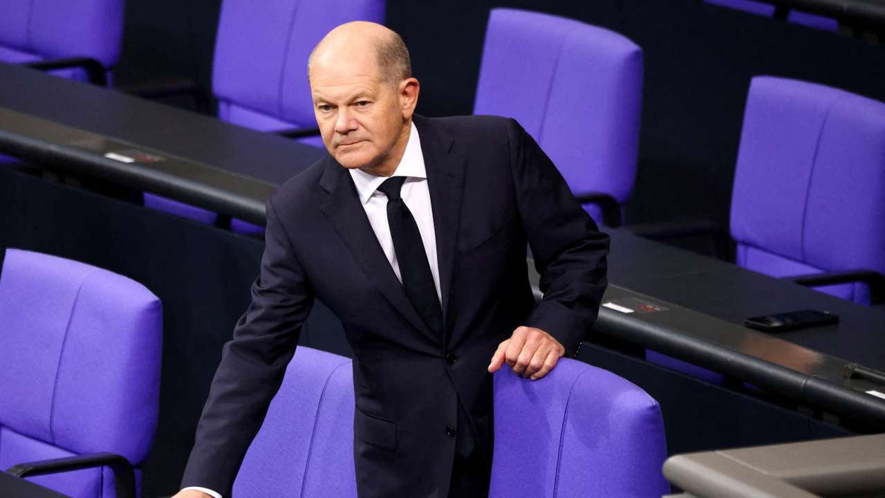 FILE PHOTO: German Chancellor Olaf Scholz reacts at the lower house of parliament