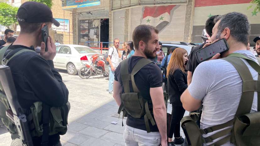 FILE PHOTO: Armed Druze men stand at checkpoint in Jaramana